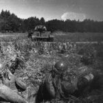 Soviet anti-tank squad hiding in tall grass.