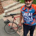 Scott in GCC jersey with red bike.